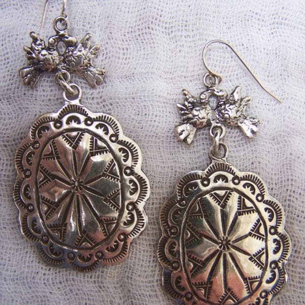E299 "Sterling conchos with silver doves"